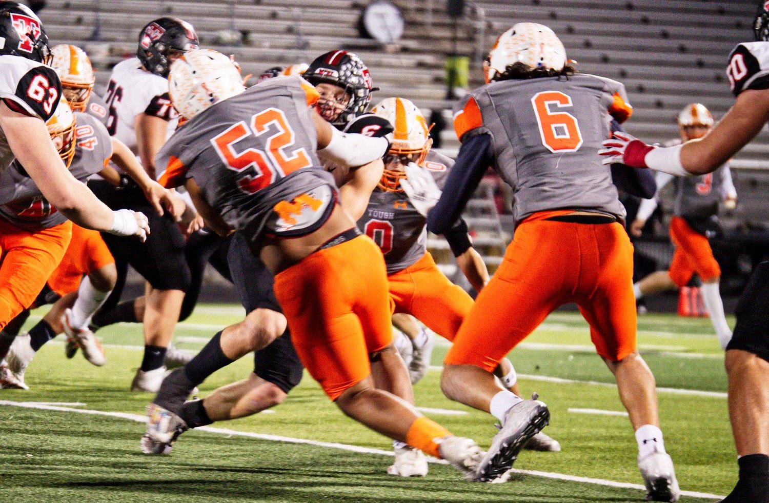 Nate Griffin (52) stops the West ballcarrier. [view more from Forney]